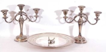 Pair of silver plated candelabra and a large silver circular pierced dish on a collet foot
