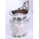 Good George III helmet cream jug, having reeded rim, foot and handle, engraved foliate and medallion