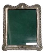Edward VII large silver photograph frame of rectangular form with decorative embossed fluted design,