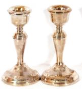 Pair of George VI dressing table candlesticks on circular bases with inverted baluster stems and