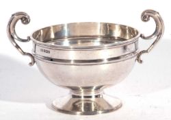 Small Edwardian pedestal rose bowl with raised body band and two swept handles, plain circular foot,