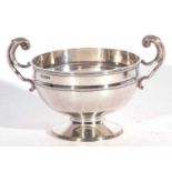 Small Edwardian pedestal rose bowl with raised body band and two swept handles, plain circular foot,