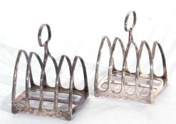 Pair of Edwardian small toast racks of five lancet bars to a shaped rectangular base, hooped