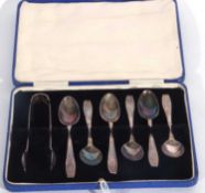 Cased set of six George V coffee spoons with garlanded embossed cut ends to the handles, together