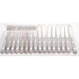 Eight pairs of Elizabeth II silver handled fish knives and forks in Kings pattern, the blades