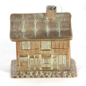 W Avery & Son, Redditch, a Victorian brass thread holder in the form of a cottage, Victorian kite
