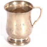 Elizabeth II christening tankard of circular baluster form to a circular foot, angular handle,