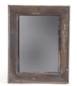 George V silver mounted dressing table mirror with foliate edge, banded engine turned inner,