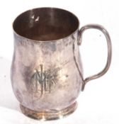 Heavy George V Arts & Crafts tankard of spot hammered baluster form to a circular foot with solid