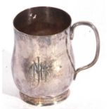 Heavy George V Arts & Crafts tankard of spot hammered baluster form to a circular foot with solid