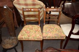 Pair of Georgian mahogany sabre leg dining chairs with floral upholstered seats