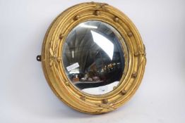 Circular mirror in gilt painted frame, 40cm diam