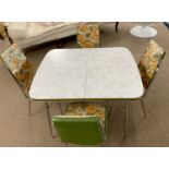 Acme marbled melamine top chrome legged extending dining table and four accompanying chairs, table