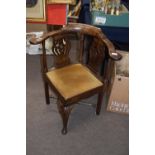 Georgian oak and elm corner chair with bowed back, pierced splats, X-formed stretcher and front