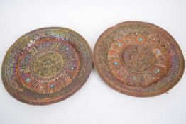 Two copper dishes, possibly Tibetan, with designs of tigers around geometric borders, 23cm wide (2)