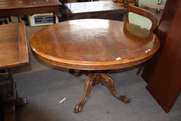 Victorian burr walnut veneered loo table with oval top, raised on a turned column and four