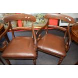 Pair of Victorian mahogany scroll arm carver chairs with brown leather seats