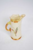 Royal Worcester tusk shaped jug, the blush ground decorated with flowers