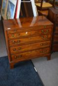 George III mahogany bachelor's chest with pull out brushing slide over four graduated drawers raised