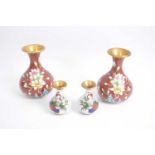 Pair of cloisonne vases with floral decoration together with a further small pair of cloisonne vases