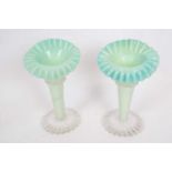 Pair of late 19th century green vaseline jack in the pulpit type vases, 22cm high