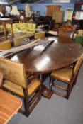 Large reproduction oval oak dining table raised on a heavy stretcher base, 244cm wide, together with