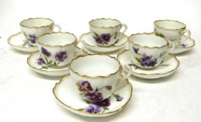 Group of six Continental porcelain Meissen style cups and saucers with floral designs