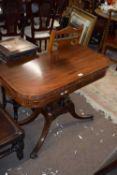 Regency mahogany and inlaid D-shaped tea table with folding top, raised on two turned pedestals