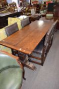 Reproduction oak refectory dining table, together with four leather upholstered dining chairs, table