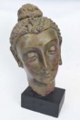Ceramic bust of an Indian lady, mounted on black rectangular base, 50cm high