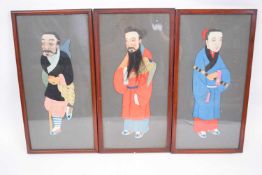 Three framed pictures of Chinese characters in fabric or silk, all in wooden frames, 40cm x 20cm (
