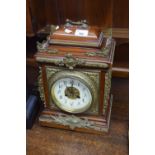 Late 19th or early 20th century mantel or bracket clock, the case with extensive applied brass