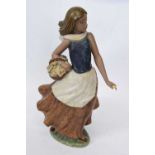 Lladro gres figure of a young girl modelled as a flower seller, 38cm high