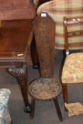 Late 19th century carved oak spinning stool decorated with floral detail, 102cm high