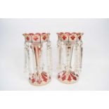 Pair of Victorian cranberry table lustres with white and gilt overlay in Bohemian style, 27cm