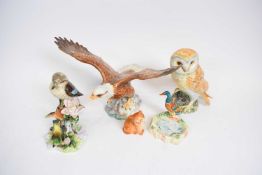 Quantity of ceramic models of birds including an owl, an eagle, Beswick eagle, and group of double