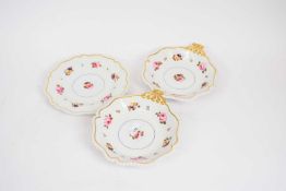 Two Worcester Flight Barr & Barr shell shaped dishes with gilt borders decorated with floral sprays,