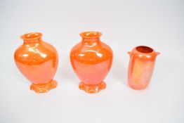 Group of three unusual Royal Doulton orange glazed vases, tallest 19cm high (3)