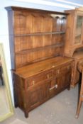 18th century style oak dresser with two shelves back over a base with two drawers and two panelled