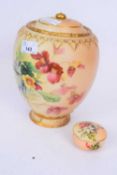 Royal Worcester vase and a cover, the blush ground painted with flowers, together with a similar