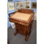 Victorian walnut veneered Davenport desk of typical form with writing slope over a base with