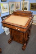 Victorian walnut veneered Davenport desk of typical form with writing slope over a base with