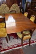 Early Victorian Gillows style mahogany extending dining table on fluted legs with brass casters,