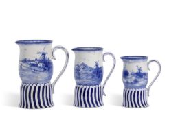 A graduated set of three late 19th century Doulton Burslem Art Nouveau jugs all printed in blue with