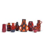 Group of West German pottery of various shapes and sizes all decorated in red and black with mottled