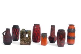 A group of west German pottery, vases all with red lava like designs in red and black, one vase with