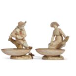 Pair of Worcester Hadley figures of children with small comports or dishes standing by treet