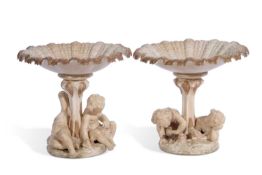 Pair of Royal Worcester figural comports or tazzas the column modelled with children, 19cm high (2)