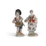 Pair of 20th century Meissen figures of flower sellers modelled as a boy and girl cross swords