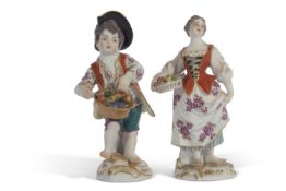Pair of 20th century Meissen figures of flower sellers modelled as a boy and girl cross swords